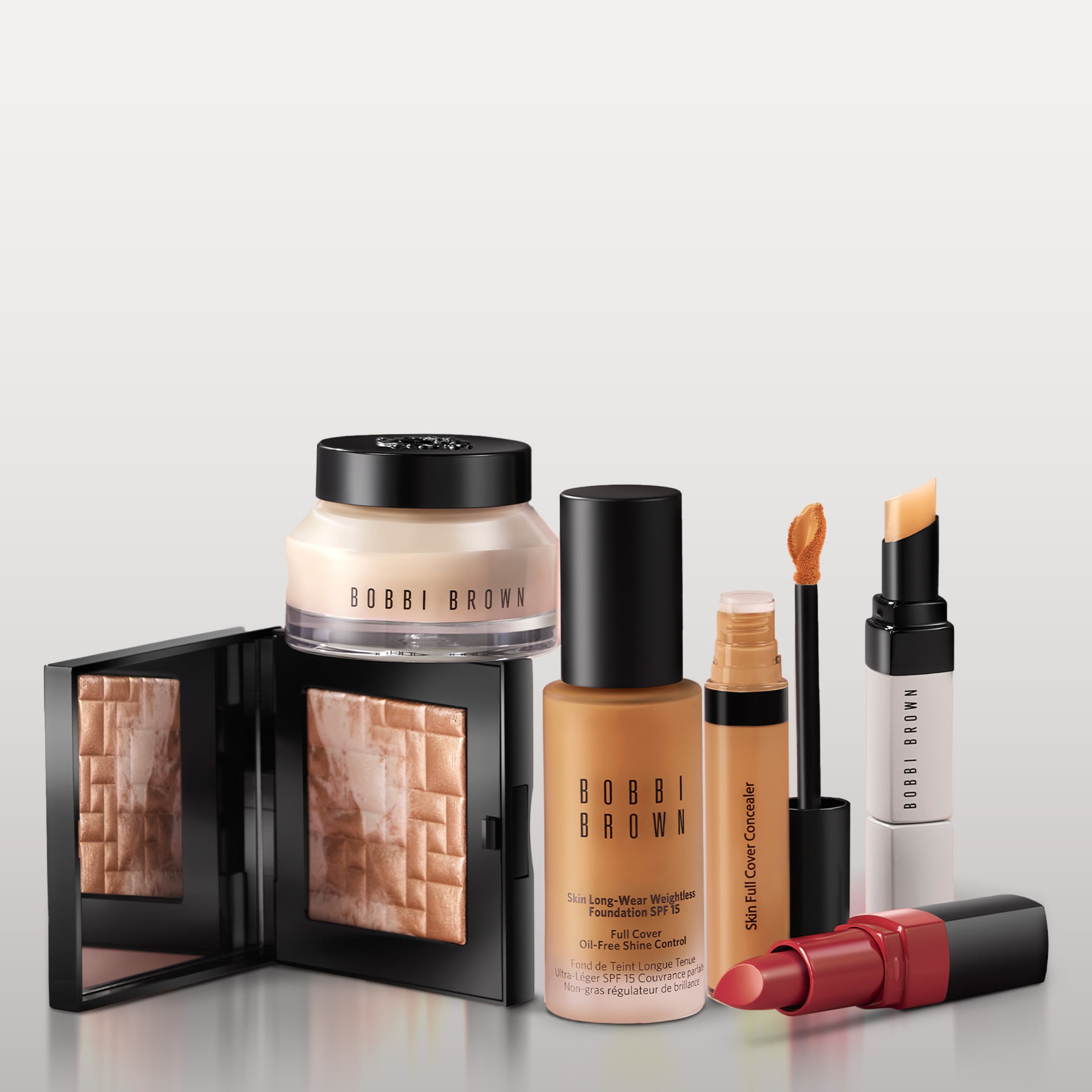 Close up of model eye showcasing defined brows and a natural, shimmery eye look